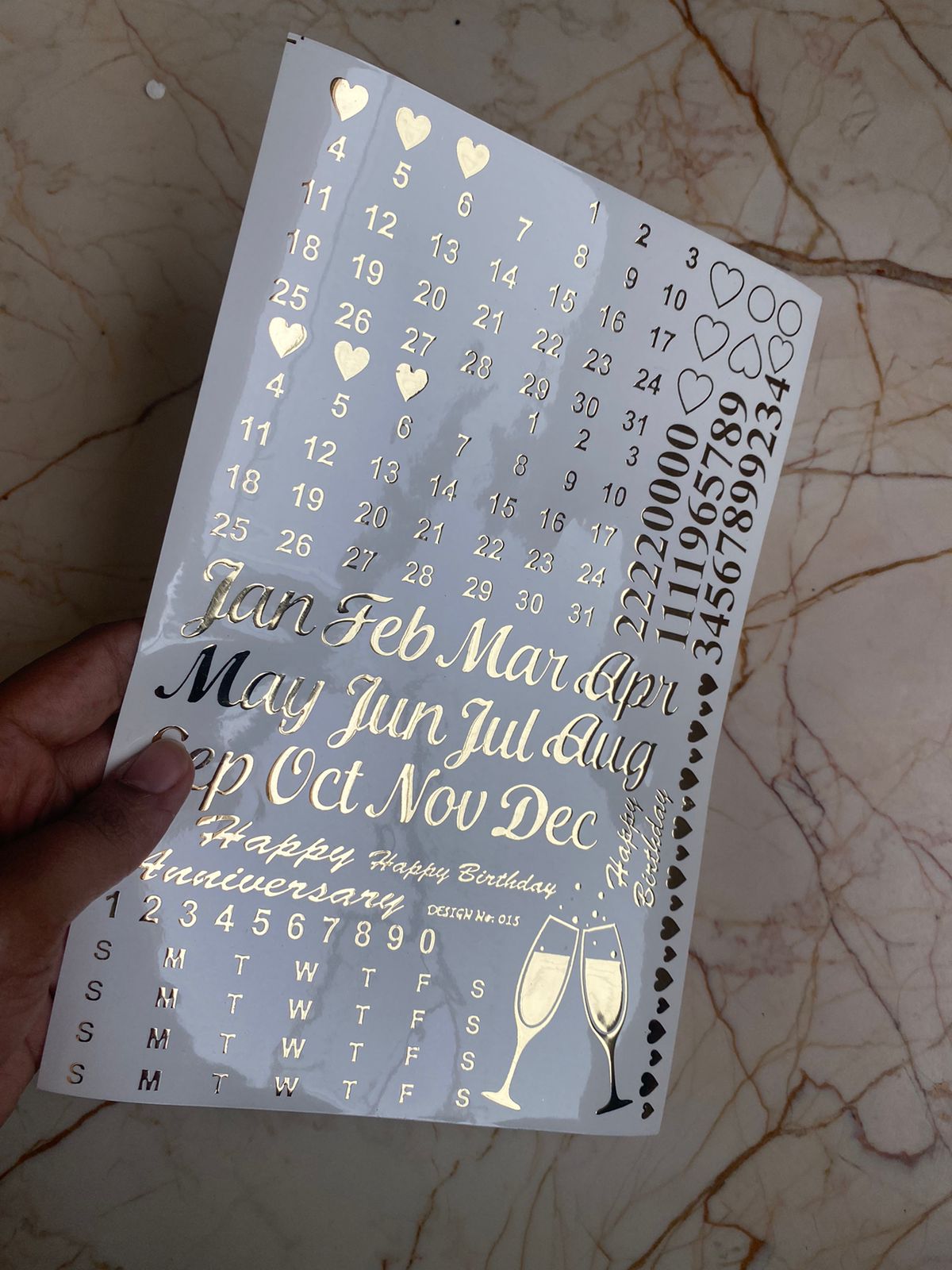 A5 size embossed calendar sticker sheet with monthly columns, weekends, and decorative elements such as hearts and a wine glass.